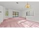 Large and open living area with sliding doors leading to the backyard at 726 Hidden Lake Dr, Tarpon Springs, FL 34689