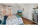 Cozy bedroom with bright decor, featuring laminate floors and a spacious closet at 7400 Sun Island Drive S # 712, South Pasadena, FL 33707
