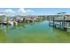 Many boats are docked at the on-site community boat slips on a bright day at 7400 Sun Island Drive S # 712, South Pasadena, FL 33707