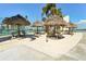 Outdoor grilling area with tiki huts, offering a tropical atmosphere for gatherings at 7400 Sun Island Drive S # 712, South Pasadena, FL 33707
