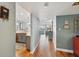 Hallway with hardwood flooring, leading to the living room and kitchen area at 7400 Sun Island Drive S # 712, South Pasadena, FL 33707