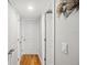 Hallway with wood floors, white doors, and neutral gray walls at 7400 Sun Island Drive S # 712, South Pasadena, FL 33707