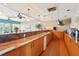 Kitchen featuring a long countertop with wood cabinets and modern appliances at 7400 Sun Island Drive S # 712, South Pasadena, FL 33707