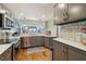 Modern kitchen with stainless appliances, light countertops, and wood floors at 7400 Sun Island Drive S # 712, South Pasadena, FL 33707