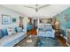 A well decorated living room, open to the kitchen, with hardwood floors at 7400 Sun Island Drive S # 712, South Pasadena, FL 33707