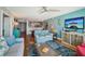 Open-concept living space with hardwood floors and views of the kitchen at 7400 Sun Island Drive S # 712, South Pasadena, FL 33707