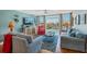 Relax in this living room, with ocean views from the floor to ceiling windows at 7400 Sun Island Drive S # 712, South Pasadena, FL 33707