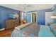 Bright main bedroom featuring a large dresser, TV and closet entrance with sliding doors at 7400 Sun Island Drive S # 712, South Pasadena, FL 33707