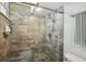 Modern shower with glass doors and rain shower head, complemented by stylish tile work at 7400 Sun Island Drive S # 712, South Pasadena, FL 33707