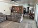 Cozy living room with gray sofas, textured carpet, and good natural light at 7430 17Th N Way, St Petersburg, FL 33702