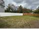 Backyard with mixed fencing, including white vinyl and wood at 7909 N Packwood Ave, Tampa, FL 33604