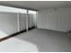 Spacious carport featuring white fencing, providing privacy and ample parking space at 7909 N Packwood Ave, Tampa, FL 33604