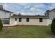 Charming single-story home with a well-manicured lawn, mulch beds and classic curb appeal at 7909 N Packwood Ave, Tampa, FL 33604