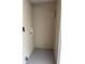 This is an interior view of the laundry room with hookups and utility access at 7909 N Packwood Ave, Tampa, FL 33604