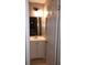 Bathroom featuring a white vanity with storage and modern light fixture at 10367 Councils Way, Temple Terrace, FL 33617