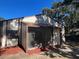 Home with a screened in porch area and nice landscaping at 10367 Councils Way, Temple Terrace, FL 33617