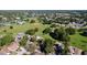 Scenic aerial view of a neighborhood with lush greenery, a park, and houses at 10408 Rosemount Dr, Tampa, FL 33624