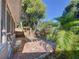 Inviting brick patio with screened-in porch and lush, mature trees surrounding the backyard at 10408 Rosemount Dr, Tampa, FL 33624