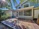 Inviting brick patio with screened-in porch, perfect for outdoor entertaining and relaxing at 10408 Rosemount Dr, Tampa, FL 33624