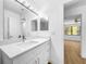 Stylish bathroom features sleek vanity, quartz countertop, and modern mirror lighting at 10408 Rosemount Dr, Tampa, FL 33624