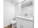Modern bathroom with white vanity, granite countertop, and contemporary fixtures at 10408 Rosemount Dr, Tampa, FL 33624