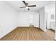 Spacious bedroom with ceiling fan, and ensuite bathroom with a modern vanity at 10408 Rosemount Dr, Tampa, FL 33624