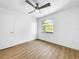 Bedroom with a modern ceiling fan and a window with natural light at 10408 Rosemount Dr, Tampa, FL 33624
