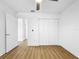 Bedroom features wood floors, a ceiling fan, and a closet at 10408 Rosemount Dr, Tampa, FL 33624