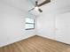 Light and airy bedroom with ceiling fan and laminate wood flooring at 10408 Rosemount Dr, Tampa, FL 33624