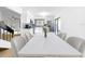 Bright dining area adjacent to the kitchen with modern table and chairs for stylish and comfortable meals at 10408 Rosemount Dr, Tampa, FL 33624