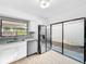 Bright kitchen with stainless steel appliances and a window view of the backyard at 10408 Rosemount Dr, Tampa, FL 33624