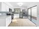 Modern kitchen with stainless steel appliances and sliding glass door at 10408 Rosemount Dr, Tampa, FL 33624