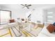 Bright living room featuring modern furniture, stylish decor, and an open layout that seamlessly flows to the outdoors at 10408 Rosemount Dr, Tampa, FL 33624
