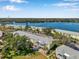 Aerial view of the condos featuring lush green trees, parking, and tranquil water views at 108 Pompano Se Dr # A, St Petersburg, FL 33705