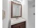 Bathroom featuring new vanity, new mirror, new sink, and a walk-in shower at 108 Pompano Se Dr # A, St Petersburg, FL 33705