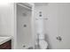 Bathroom featuring walk-in shower, new toilet, new shower head, and tile flooring at 108 Pompano Se Dr # A, St Petersburg, FL 33705