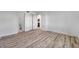 Bedroom featuring hardwood floors, neutral walls, and access to the bathroom at 108 Pompano Se Dr # A, St Petersburg, FL 33705