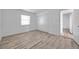 Bedroom showcasing hardwood floors, neutral walls, and ample closet space at 108 Pompano Se Dr # A, St Petersburg, FL 33705