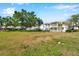 A view of the community buildings and exterior, surrounded by landscaping and lawns at 108 Pompano Se Dr # A, St Petersburg, FL 33705