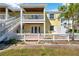 Charming two-story home with a white picket fence, balcony and a staircase leading to the upper level at 108 Pompano Se Dr # A, St Petersburg, FL 33705