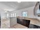 Kitchen with granite countertops, stainless steel dishwasher, and an open design to living area at 108 Pompano Se Dr # A, St Petersburg, FL 33705
