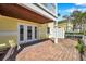 Brick patio with access to the house and an upper deck, views of the lake at 108 Pompano Se Dr # A, St Petersburg, FL 33705