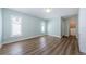 Bright bedroom with windows, walk in closet, and luxury vinyl plank flooring at 1113 Carlton Rd, Tarpon Springs, FL 34689