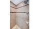 Tiled shower stall featuring brown and white tile design and shower head at 1113 Carlton Rd, Tarpon Springs, FL 34689