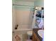 Standard bathroom with a shower/tub combo, and tile flooring, ensuring a practical space at 122 Pompano Se Dr # A, St Petersburg, FL 33705