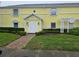 Charming condo with white trim, shutters, and manicured landscaping framing the entrance at 122 Pompano Se Dr # A, St Petersburg, FL 33705