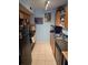Functional kitchen with appliances, tile floors, and ample counter space at 122 Pompano Se Dr # A, St Petersburg, FL 33705