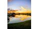 Stunning sunset over the lake, creating vibrant reflections on the water's surface at 122 Pompano Se Dr # A, St Petersburg, FL 33705
