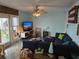Inviting living room with stylish furnishings, large TV, and a comfortable sofa at 122 Pompano Se Dr # A, St Petersburg, FL 33705