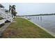 Waterfront property featuring a well-maintained lawn and waterfront access, ideal for boating at 122 Pompano Se Dr # A, St Petersburg, FL 33705